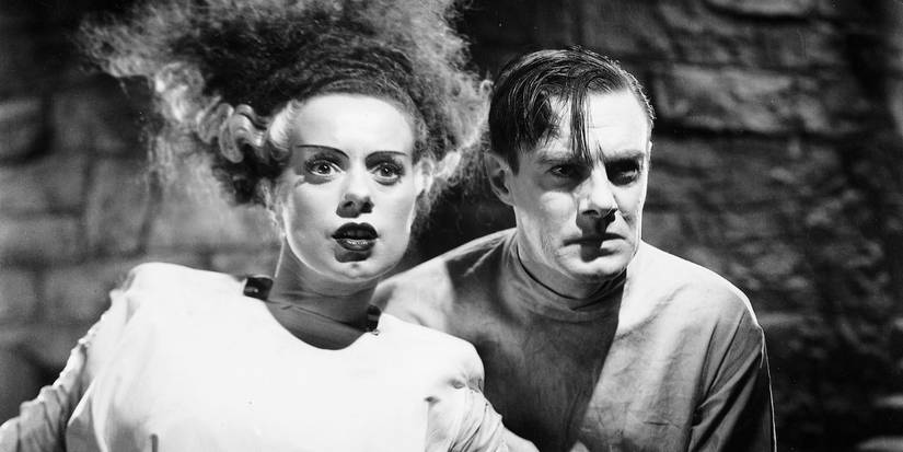 The Monster's Mate (Elsa Lanchester) and Doctor Henry Frankenstein (Colin Clive) looking ahead in 'Bride of Frankenstein' (1935)