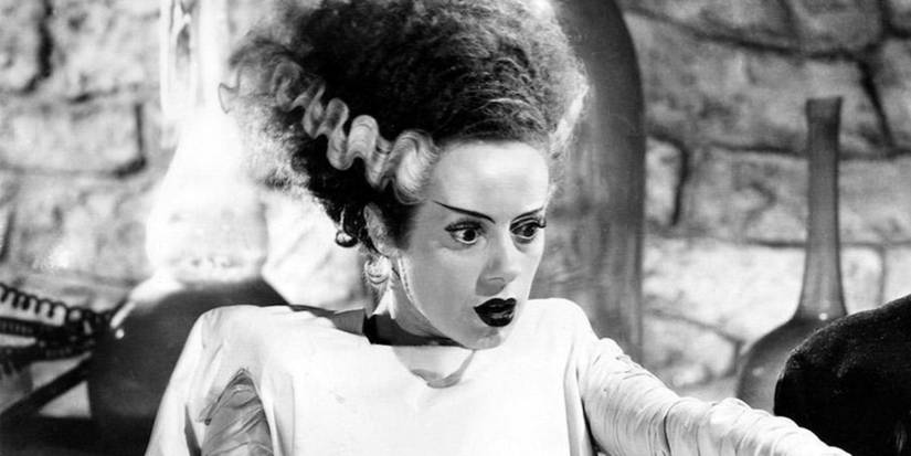 The Bride pointing at something off-camera in Bride of Frankenstein.