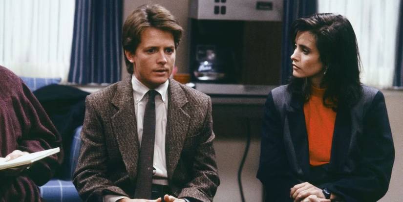 Alex with his girlfriend sitting together in Family Ties.