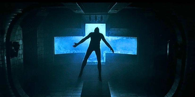 A lifeless body floats inside a dimly lit spaceship in Event Horizon.