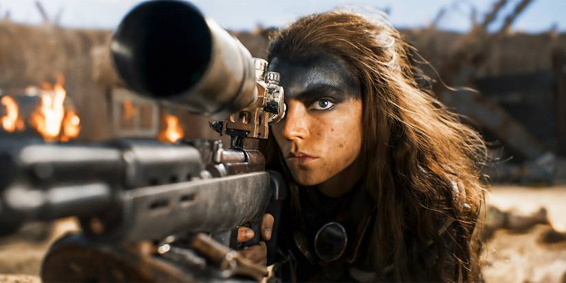 Furiosa holding a gun in Furiosa: A Mad Max Saga