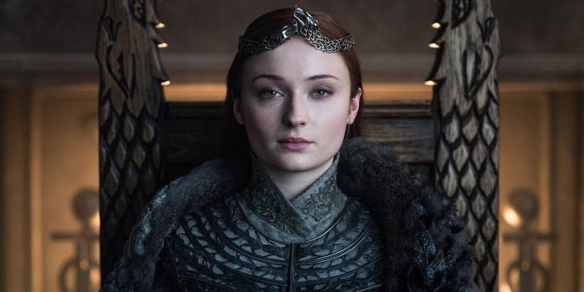 Sansa Stark (Sophie Turner) sits in the hall of Winterfell crowned the Queen of the North in Game of Thrones.