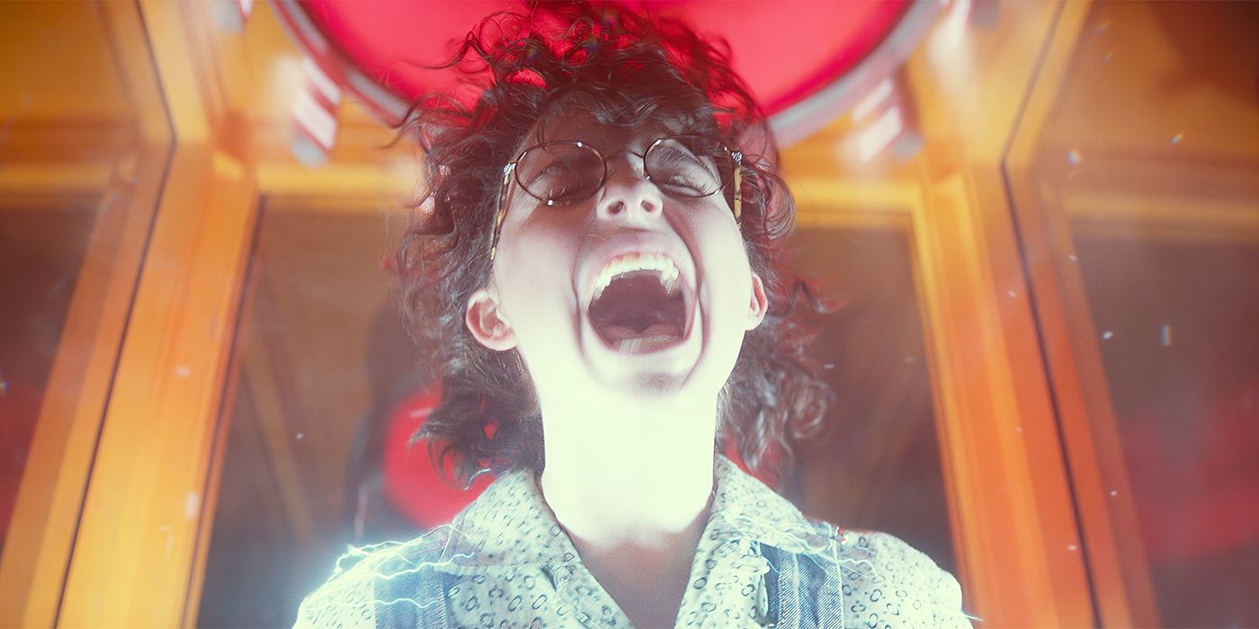 Mckenna Grace screaming and lit by an electric current in Ghostbusters: Frozen Empire