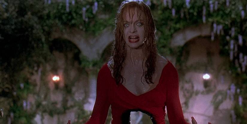 Goldie Hawn with a shotgun hole through her stomach and grey eyes in Death Becomes Her