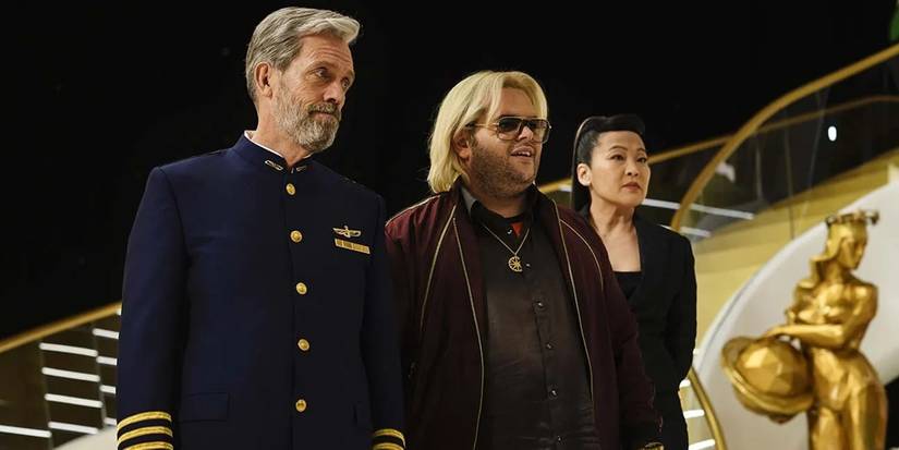 Hugh Laurie as Ryan, Josh Gad as Herman Judd, and Suzy Nakamura as Iris standing together in Avenue 5