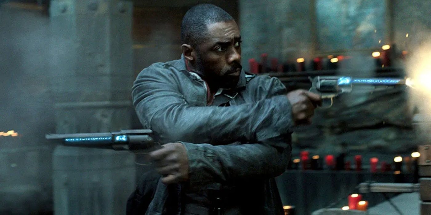 Idris Elba as Roland Deschain firing two gun in The Dark Tower
