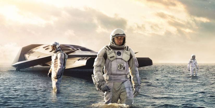 Cooper, Brand, and Doyle exploring an ocean world in Interstellar  