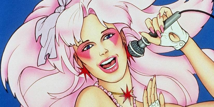 Jem singing into a microphone in the animated series Jem