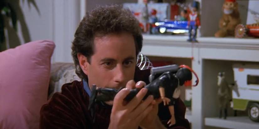 Jerry Seinfeld playing with toys in The Merv Griffin Show episode of Seinfeld