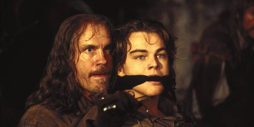 John Malkovich as Athos holds Leonardo DiCaprio as King Louis XIV hostage in The Man in the Iron Mask.