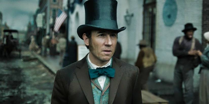 Tobias Menzies walking down the street in Apple TV+'s Manhunt