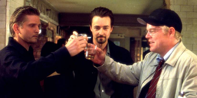 Barry Pepper, Edward Norton and Philip Seymour Hoffman clinking glasses in 25th Hour