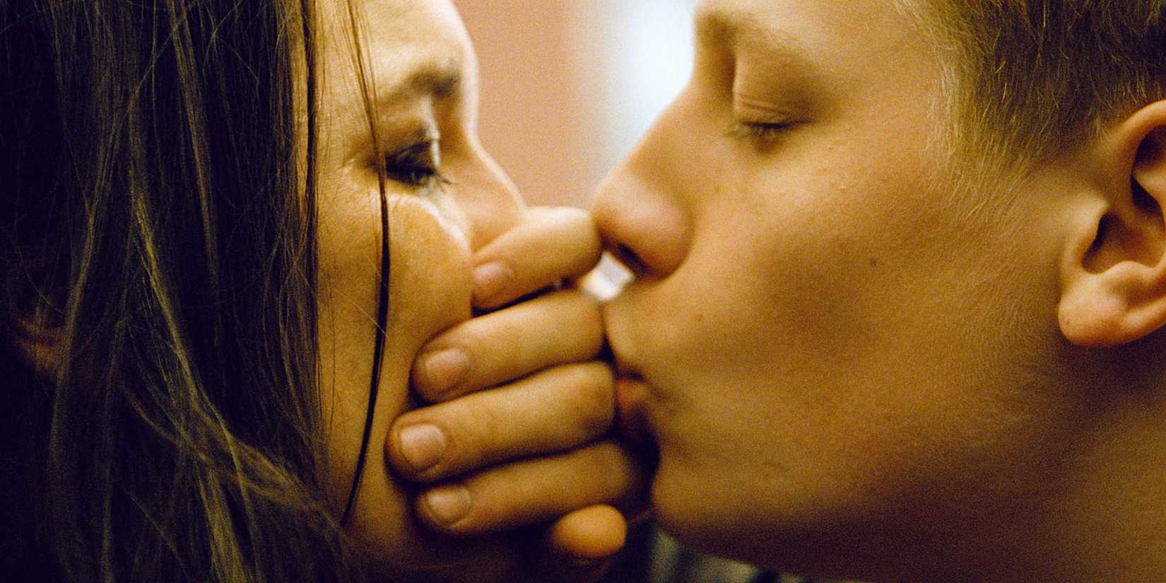 A man covering a woman's mouth in the film Mommy 2014