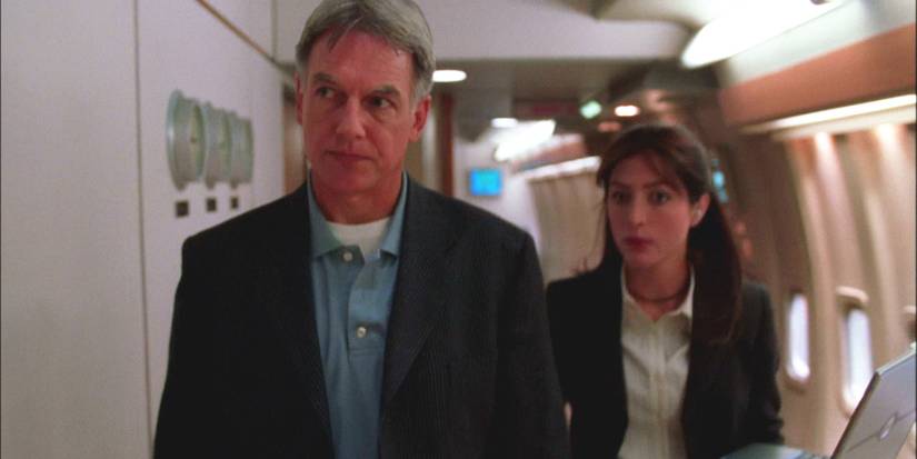 A male and female character walking down a hallway in NCIS
