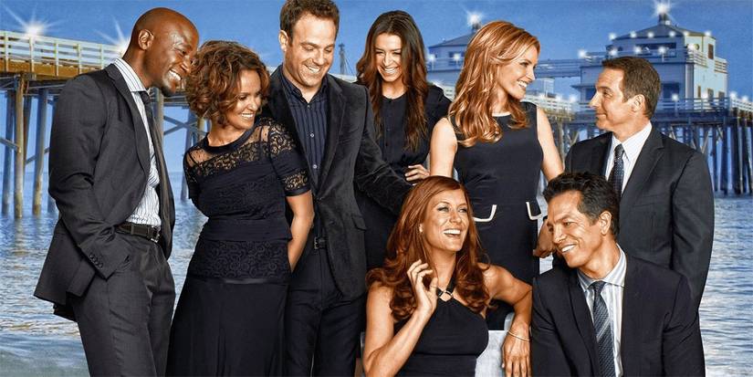 The cast of Private Practice laughs in a promotional image.