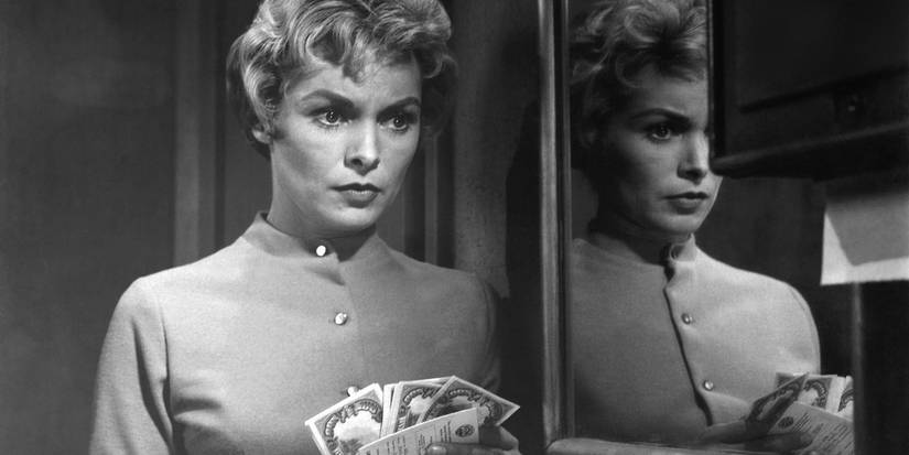 Janet Leigh holds money and looks worried in Alfred Hitchcock's Psycho