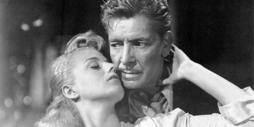 Tony John with a woman in A Double Life