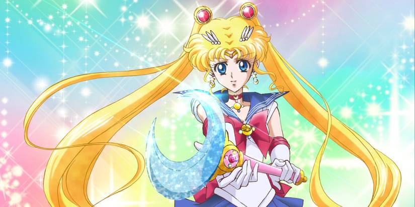 Sailor Moon holding a wand with a moon on the end in Sailor Moon Crystal