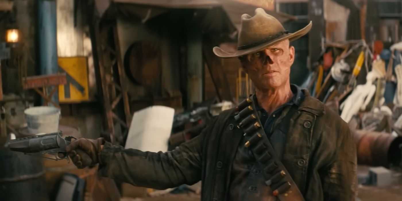 Walton Goggins as The Ghoul holds his arms wide with a gun loose in one hand in Prime Video's 'Fallout'