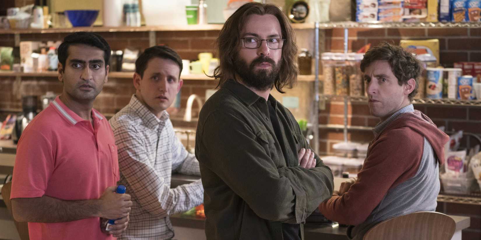 Dinesh Chugtai (Kumail Nanjiani), Jared Dunn (Zach Woods), Bertram Gilfoyle (Martin Starr), and Richard Hendricks (Thomas Middleditch) worked together at Pied Piper on Silicon Valley.