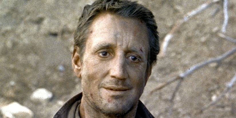 Roy Scheider as Jackie Scanlon smiling slightly in Sorcerer (1977)