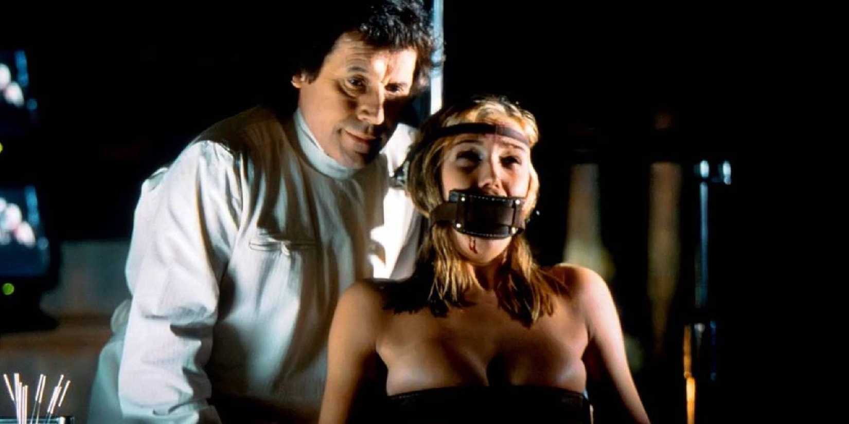 Stephen Rea and Natascha McElhone in Feardotcom. She is scrraming while her mouth is taped.
