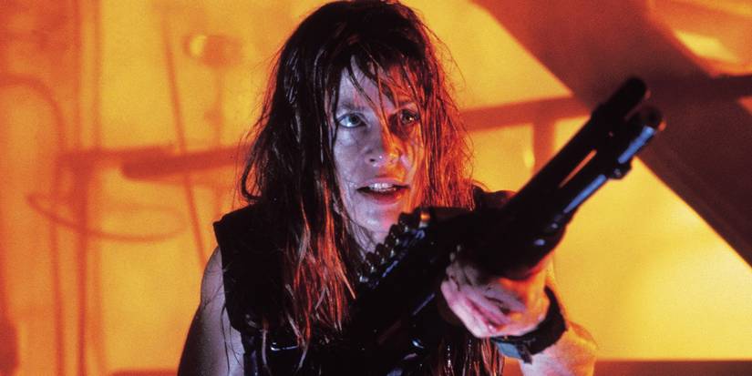 Linda Hamilton as Sarah Connor aiming a rifle in Terminator 2: Judgment Day