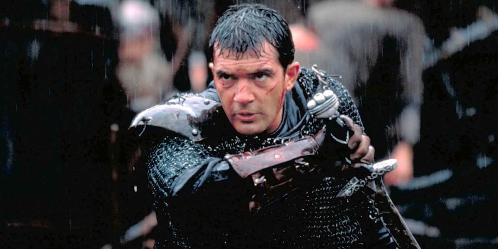 Ahmed brandishing a sword under the rain in The 13th Warrior