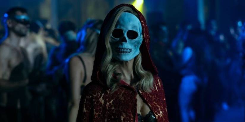 A woman in a skeleton mask stares in 'The Fall of the House of Usher' (2023, Netflix)