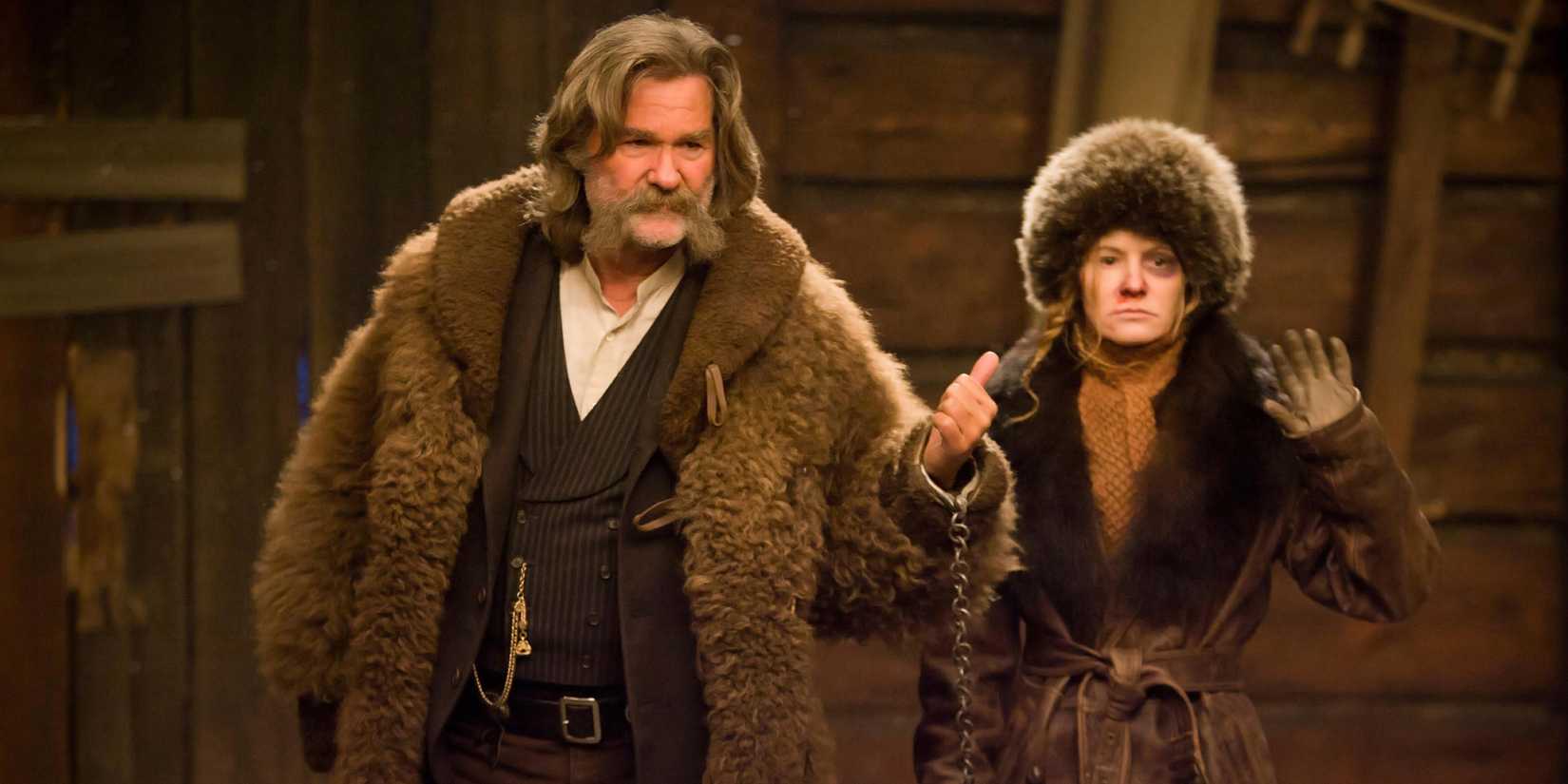 John "The Hangman" and "Crazy" Daisy walking into a cabin in The Hateful Eight.