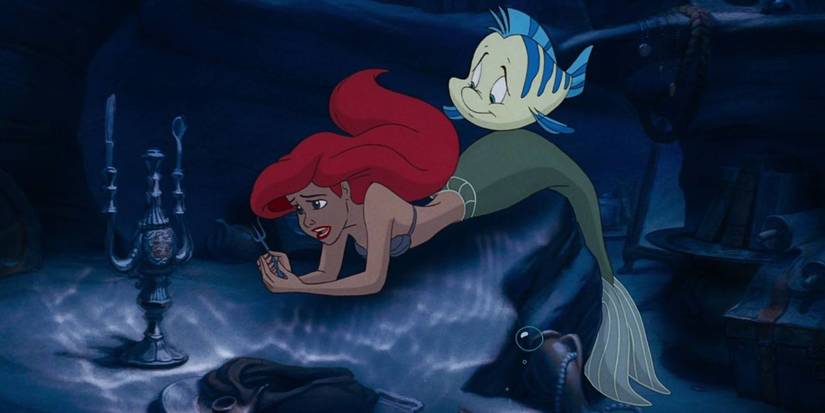 Ariel looks troubled and sings as Flounder is nearby in Ariel's grotto in The Little Mermaid