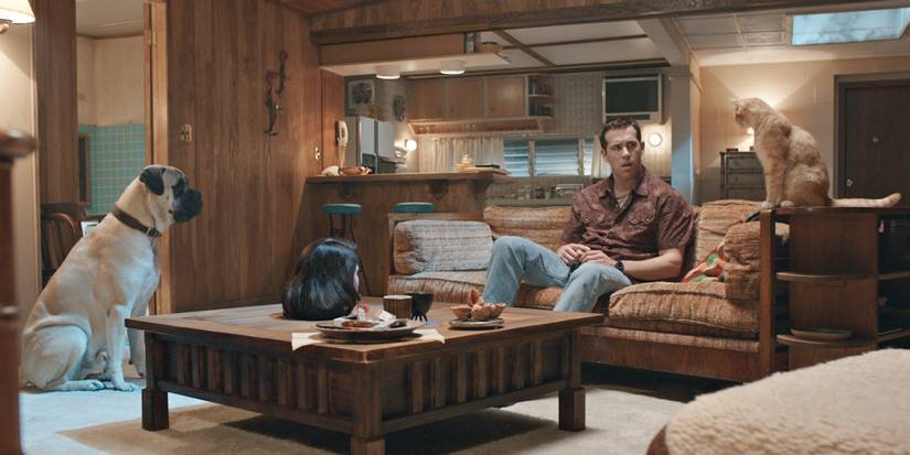 Jerry Hickfang, sitting with his dog, cat, and Fiona's severed head in The Voices