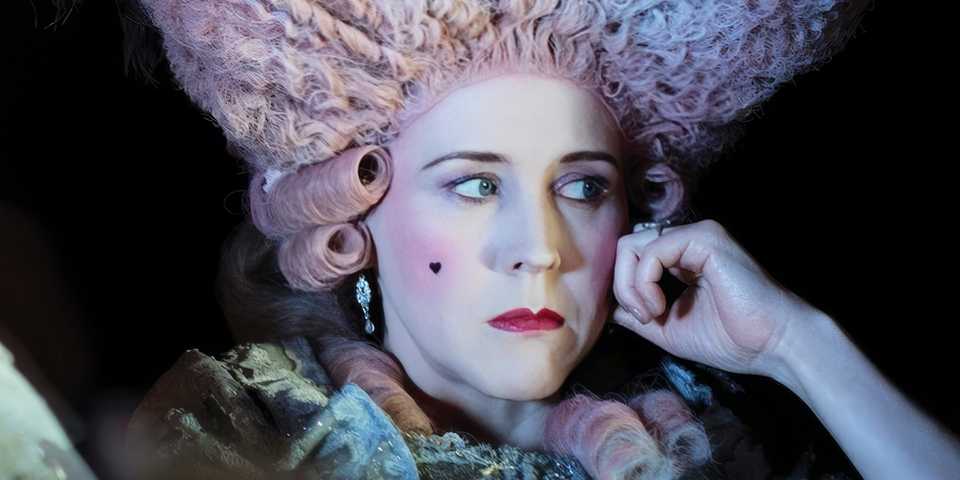 Alice Lowe as Agnes sitting in the darkness wearing a period costume in Timestalker.