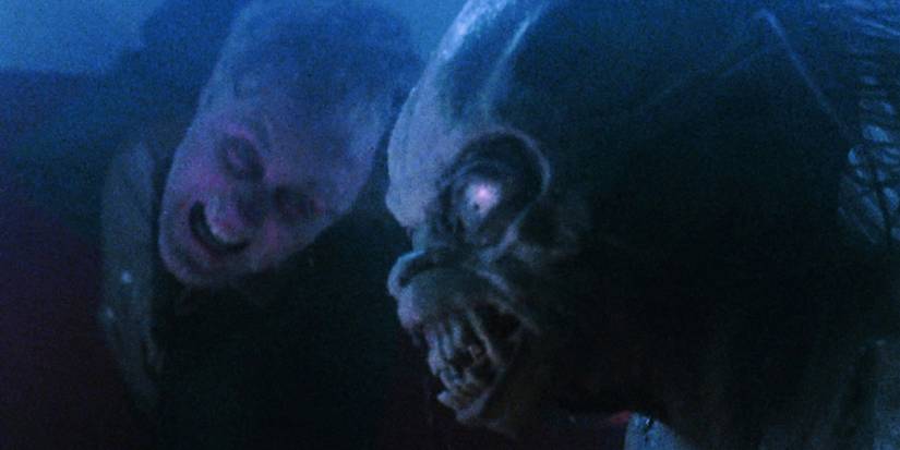 John Valentine (John Lithgow) stares at the Gremlin from outside the plane in 'Twilight Zone: The Movie'