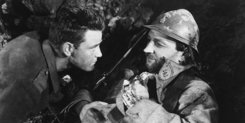 Two soldiers sharing a moment in the trenches in  All Quiet on the Western Front