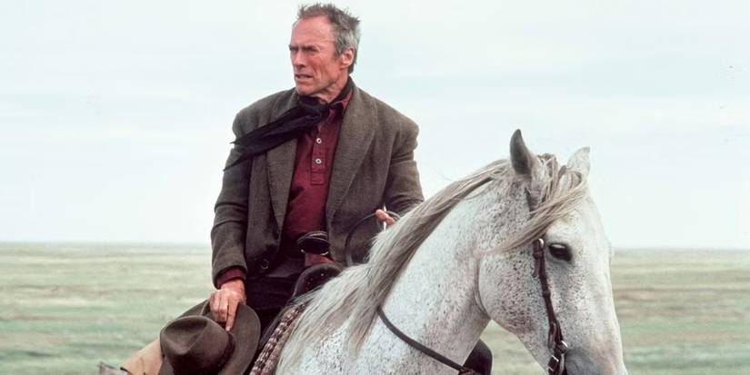 Clint Eastwood as Bill Munny sitting on a horse in Unforgiven