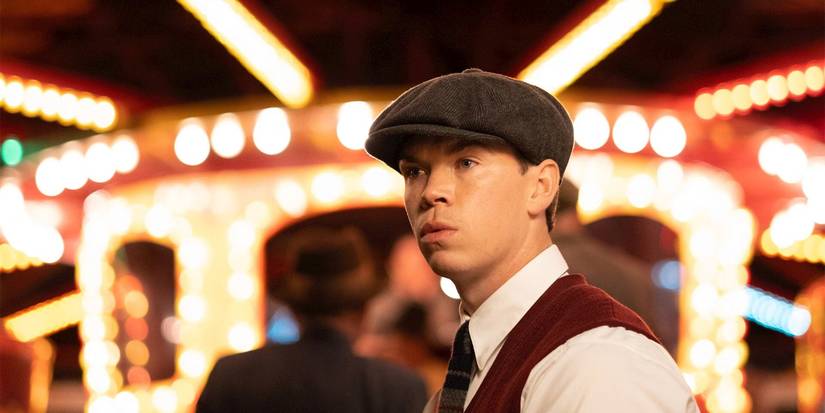 Bobby Jones (Will Poulter) looking offscreen with a concerned expression and wearing a grey cap in Why Didn't They Ask Evans?