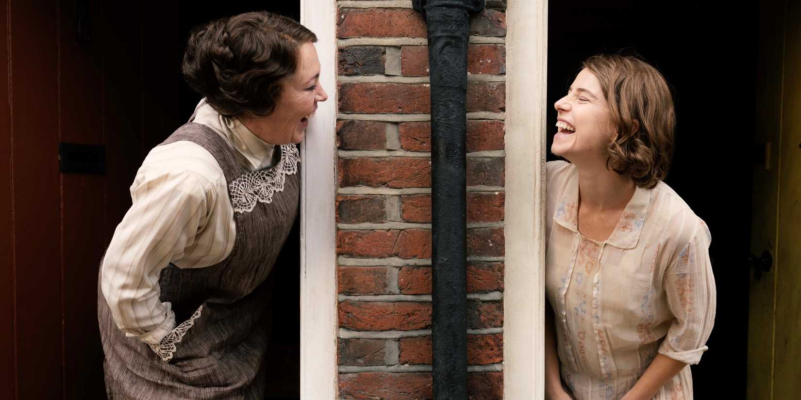 Olivia Colman as Edith Swan laughing with Jessie Buckley in Wicked Little Letters