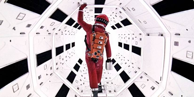 An astronaut walking through a corridor on a space station in 2001 A Space Odyssey