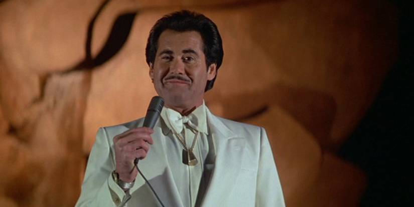 Wayne Newton holding a microphone in 'License to Kill'