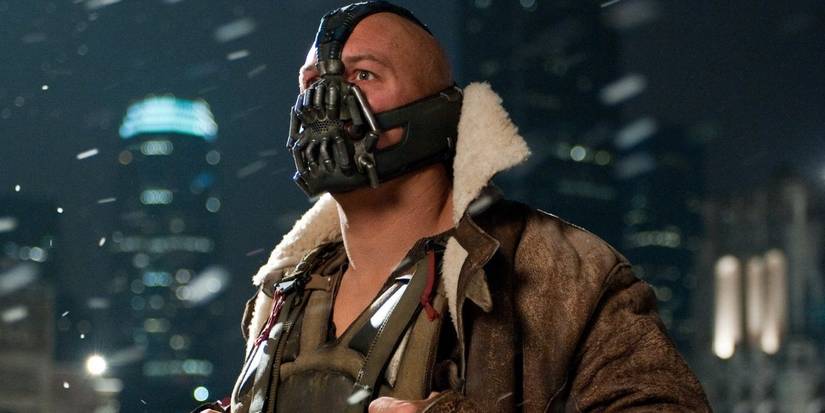 Bane, clad in his iconic mask, looking intently in The Dark Knight Rises.