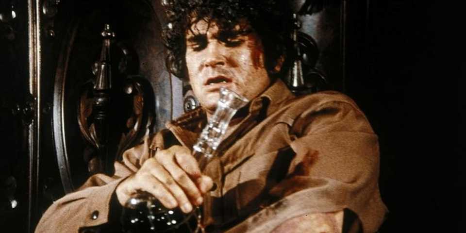 Little Joe Cartwright (Michael Landon) treating his wound on the 'Bonanza' episode "A Matter of Circumstance."