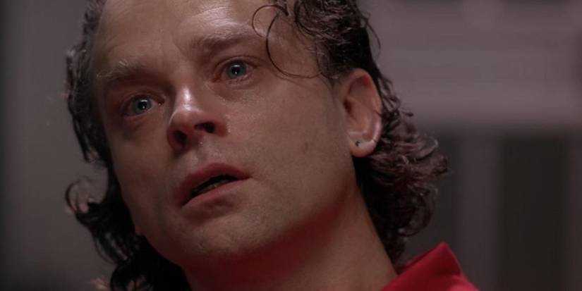 Brad Dourif looks up as he sees a vision from prison cell in Beyond the Sea in The X-Files