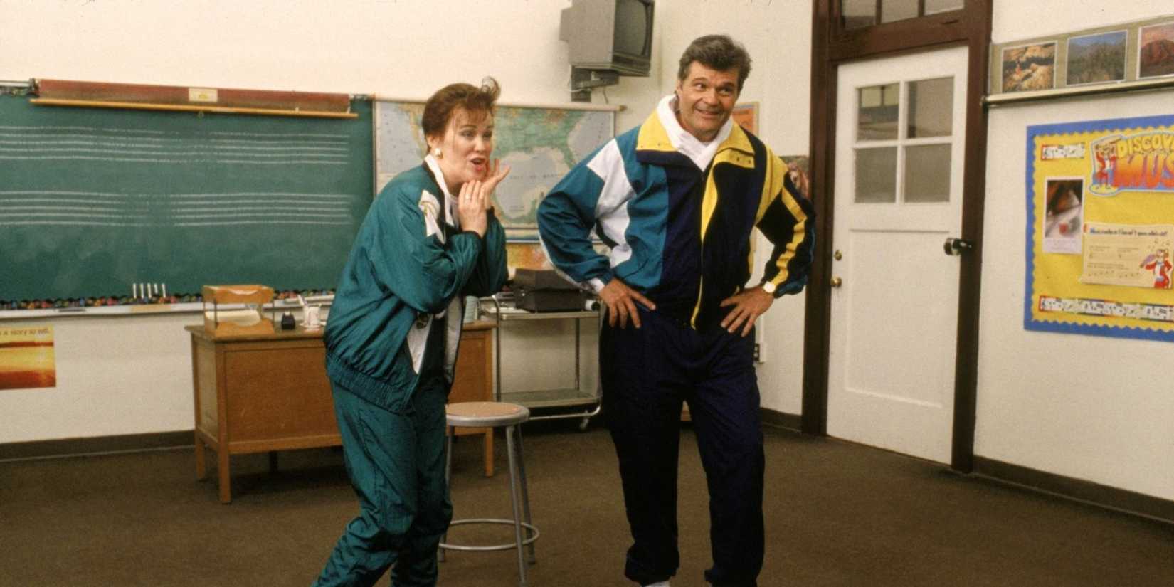 Shelia and Ron Albertson performing in a classroom in Waiting for Guffman