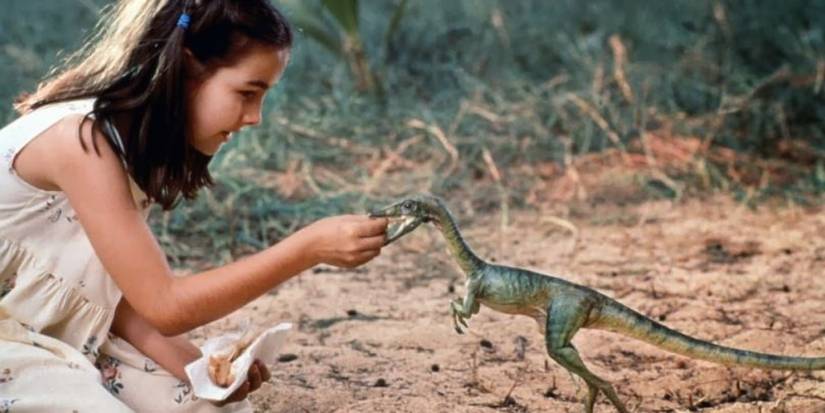 Cathy Bowman (Camilla Belle) feeds a small dinosaur, a Compy, at the beginning of 'The Lost World: Jurassic Park'