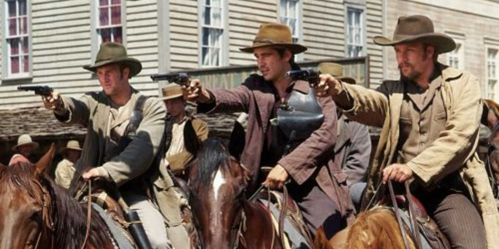 Colin Farrell, Scott Caan, and Gabriel Macht sit atop horses and fire their guns in American Outlaws
