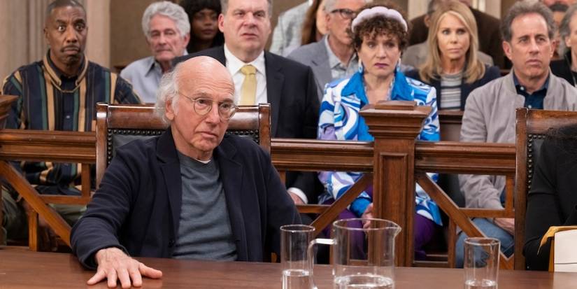 Larry rests his hand on the desk in court for the series finale of 'Curb Your Enthusiasm'.