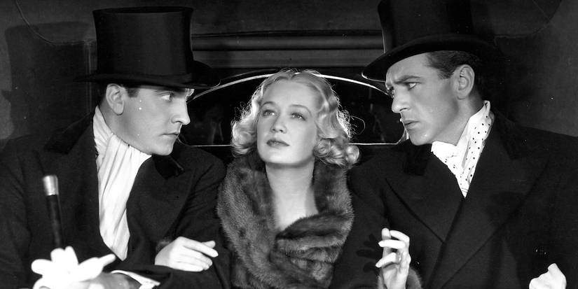 Frederic March, Miriam Hopkins, and Gary Copper in the back of a car in Design for Living