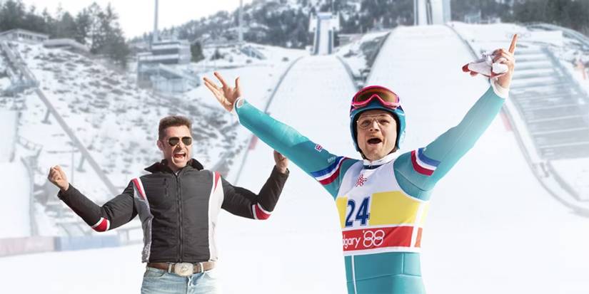 Hugh Jackman and Taron Egerton celebrating in 'Eddie the Eagle'