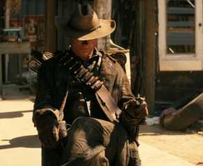 Walton Goggins as The Ghoul sitting with his head tipped down in Prime Video's 'Fallout'